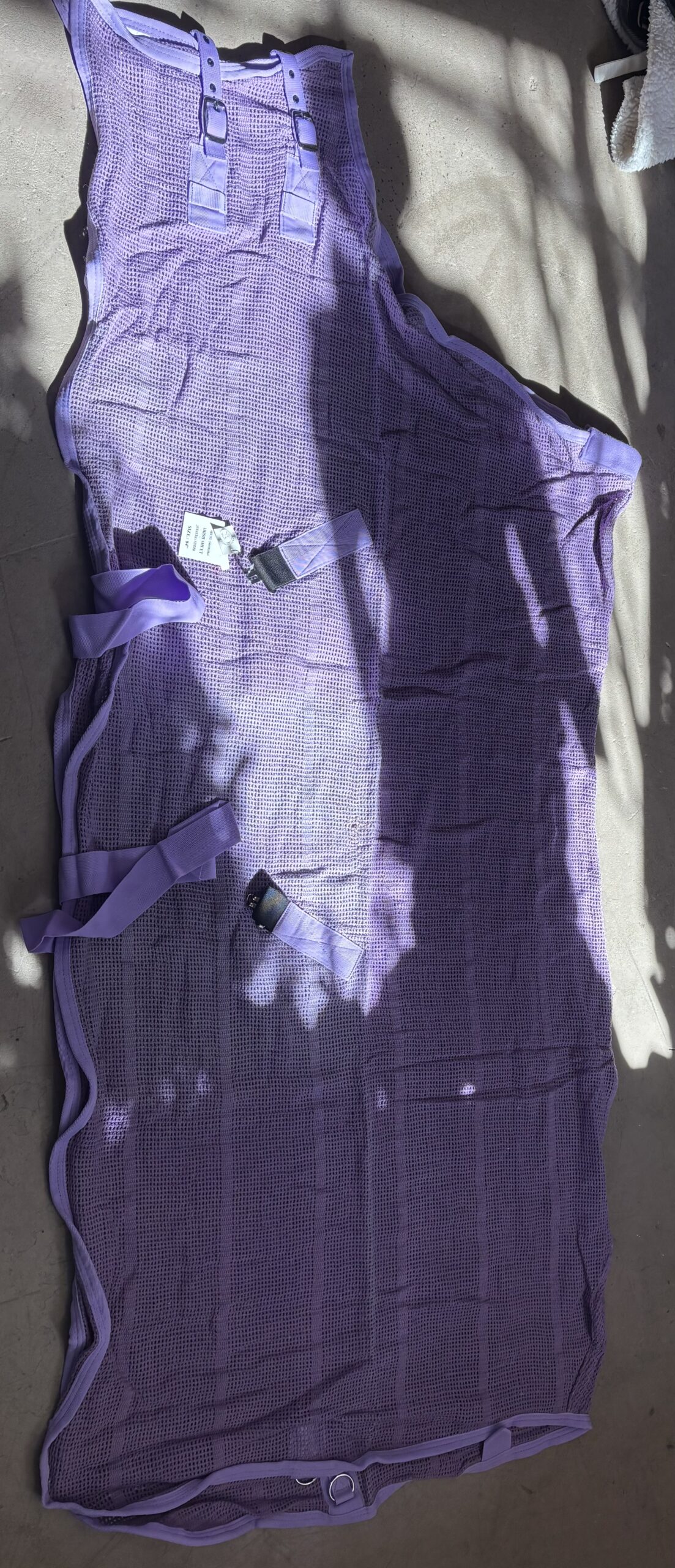 Lavender Woven Mesh Cooler 84 Inch 1 Lavender woven mesh horse cooler measuring 84 inches with buckle closure and fleece wither protection