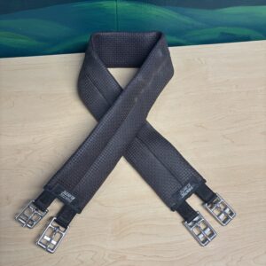 The Wintec Elastic Long Girth Black is a reliable and comfortable choice for English riders seeking durability and performance. Made with cushioned material to ensure even pressure distribution and excellent airflow thanks to its moisture-wicking design. Its grippy texture helps prevent slipping while dissipating heat to keep your horse comfortable throughout the ride. This practical and well-engineered girth supports your horse's comfort while offering ease of maintenance every rider appreciates. Product Details: Color: Black Cushioned synthetic construction Porous material promotes moisture wicking & breathability Grippy texture helps prevent saddle slipping Fully elastic center covered with anti-galling material Stainless steel roller buckles allow secure adjustments Easy to clean Available in sizes 44" - 54"